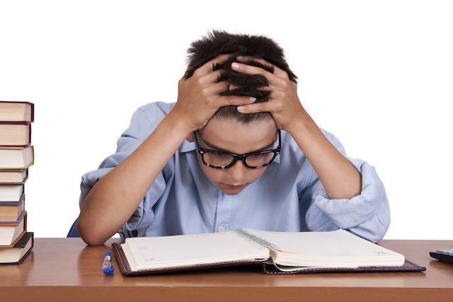 boy with books on the study table